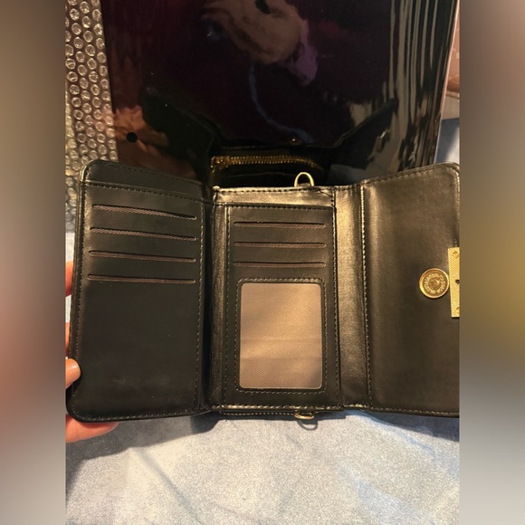 New vegan leather black mini top handle bag with a gold tone lock closure - Picture 3 of 3